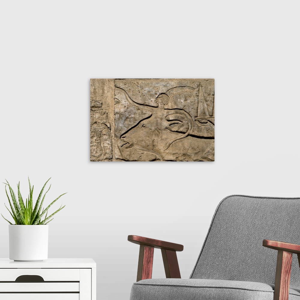 A modern room featuring Egyptian Art. Egypt. Relief of the religious procession of the great bulls, to commemorate the op...