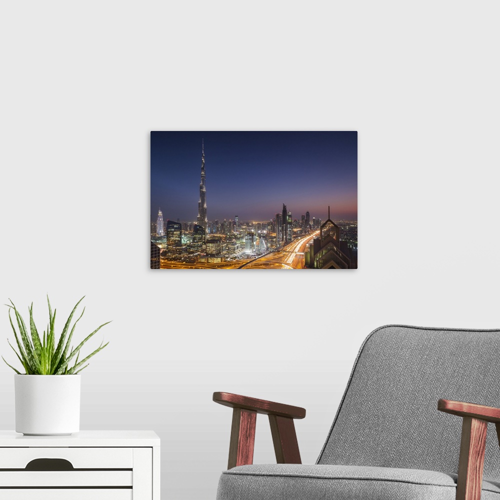 A modern room featuring UAE, Dubai, Downtown Dubai, eleavted view over Sheikh Zayed Road and Burj Khalifa Tower, world's ...