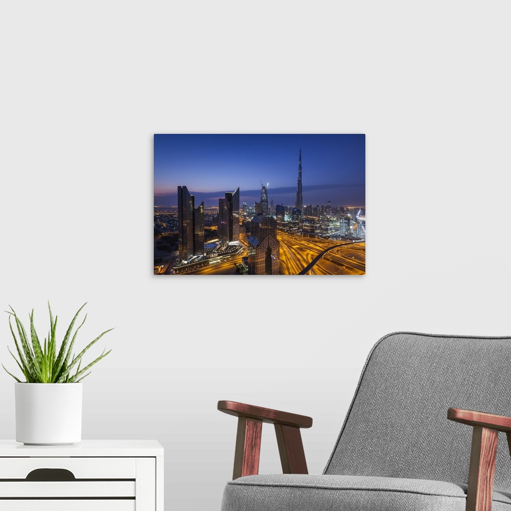 A modern room featuring UAE, Dubai, Downtown Dubai, eleavted view over Sheikh Zayed Road and Burj Khalifa Tower, world's ...