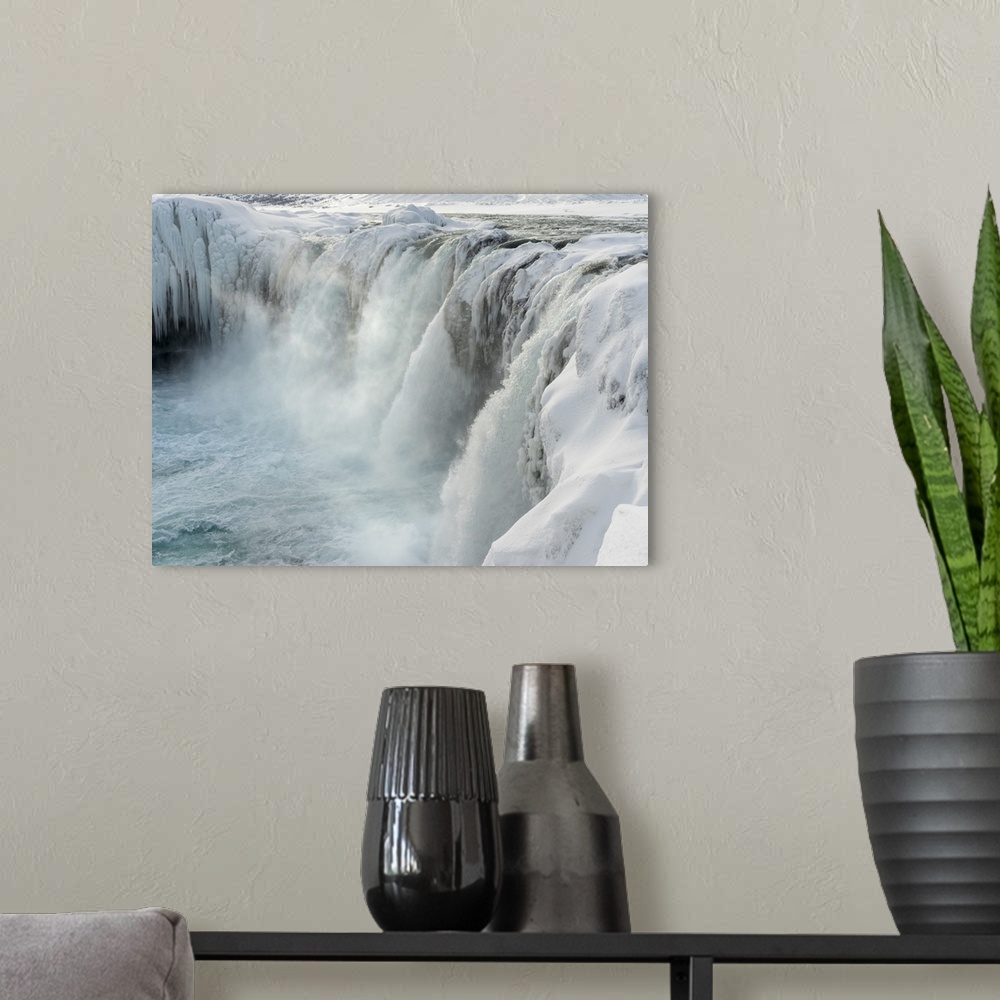 A modern room featuring Godafoss waterfall of Iceland during winter. .