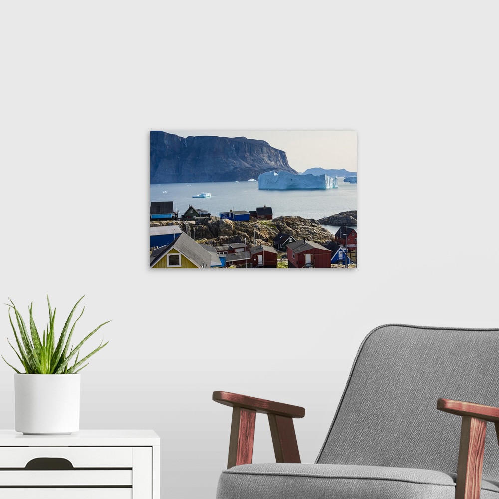 A modern room featuring Greenland. Uummannaq. Colorful houses dot the rocky landscape.