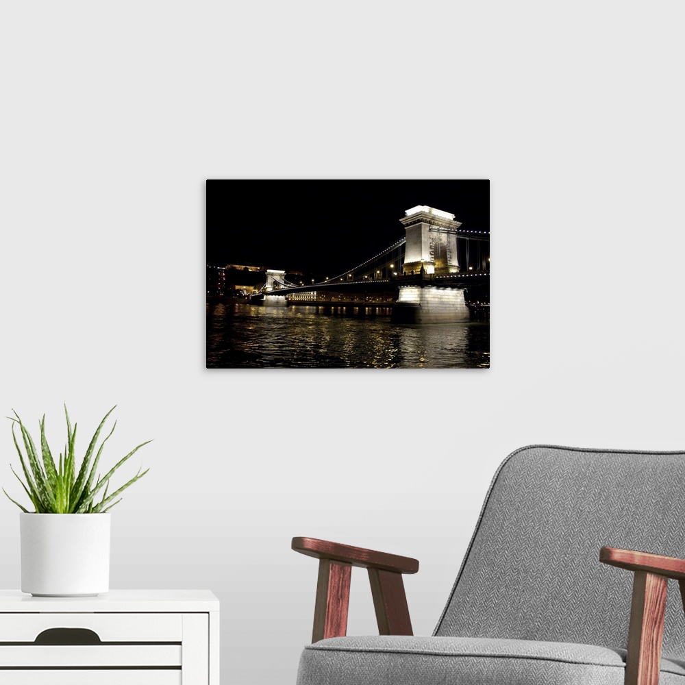 A modern room featuring Hungary, Budapest. Night view of "Chain Bridge" from Pest across the Danube River to Castle Hill ...