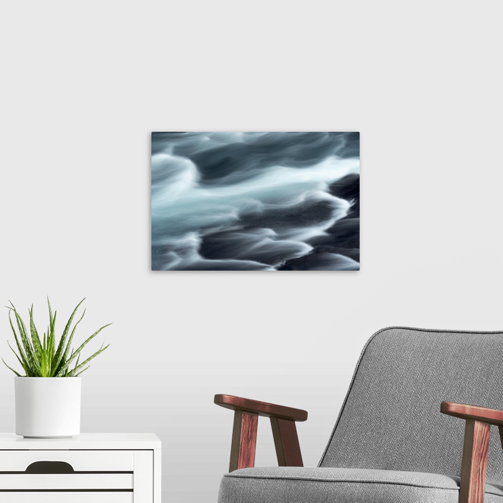 A modern room featuring Iceland, Hraunfossar, Hvita River. The Hvita River flow quickly, creating patterns with a slow sh...