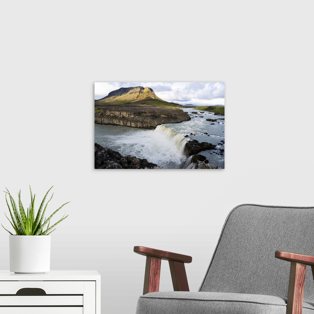 A modern room featuring Iceland, Southern Highlands, Pjorsa River. The Pjorsa River flowing into the Pjofafoss waterfall ...