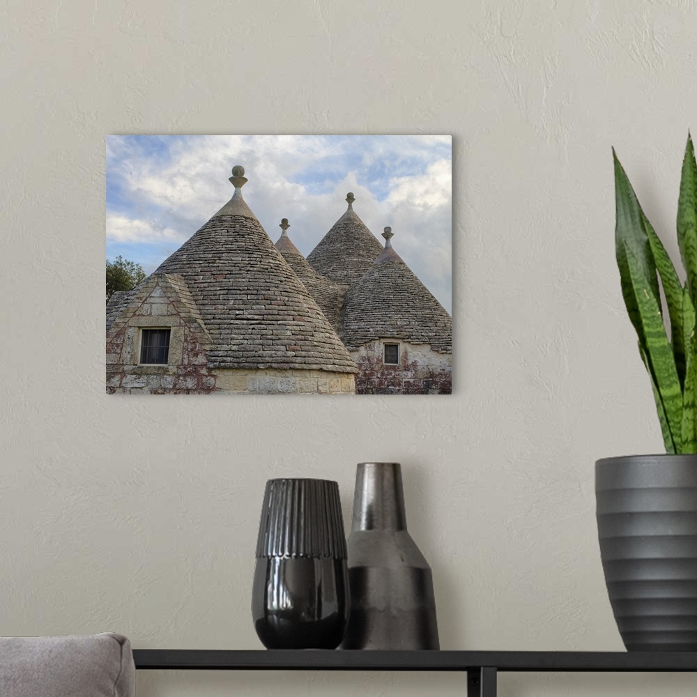 A modern room featuring Italy, Alberobello. Rooftops of the typical trulli houses in Alberobello.