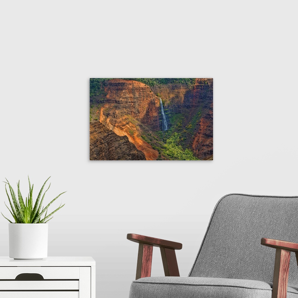 A modern room featuring Kauai Hawaii, scenic Waimea Canyon State Park, Red cliffs from above canyon with distant waterfall