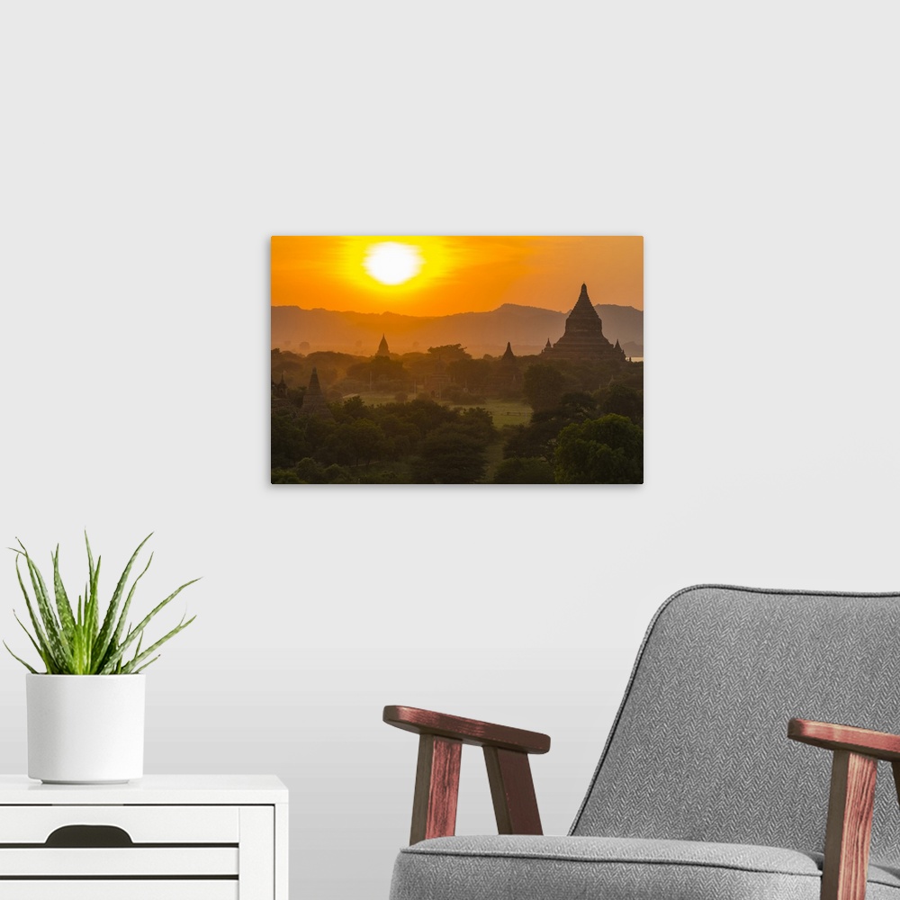A modern room featuring Myanmar. Bagan. Temples at sunset.