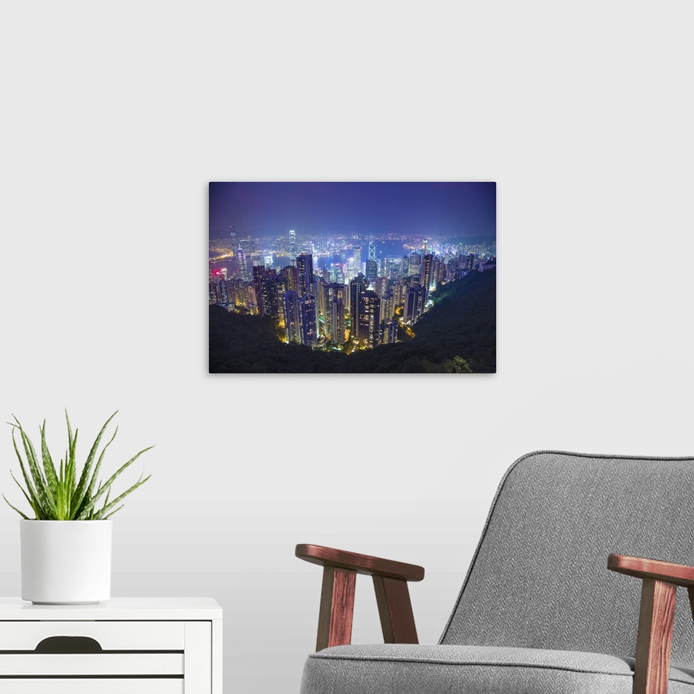 A modern room featuring China, Hong Kong. Overview of city at night.