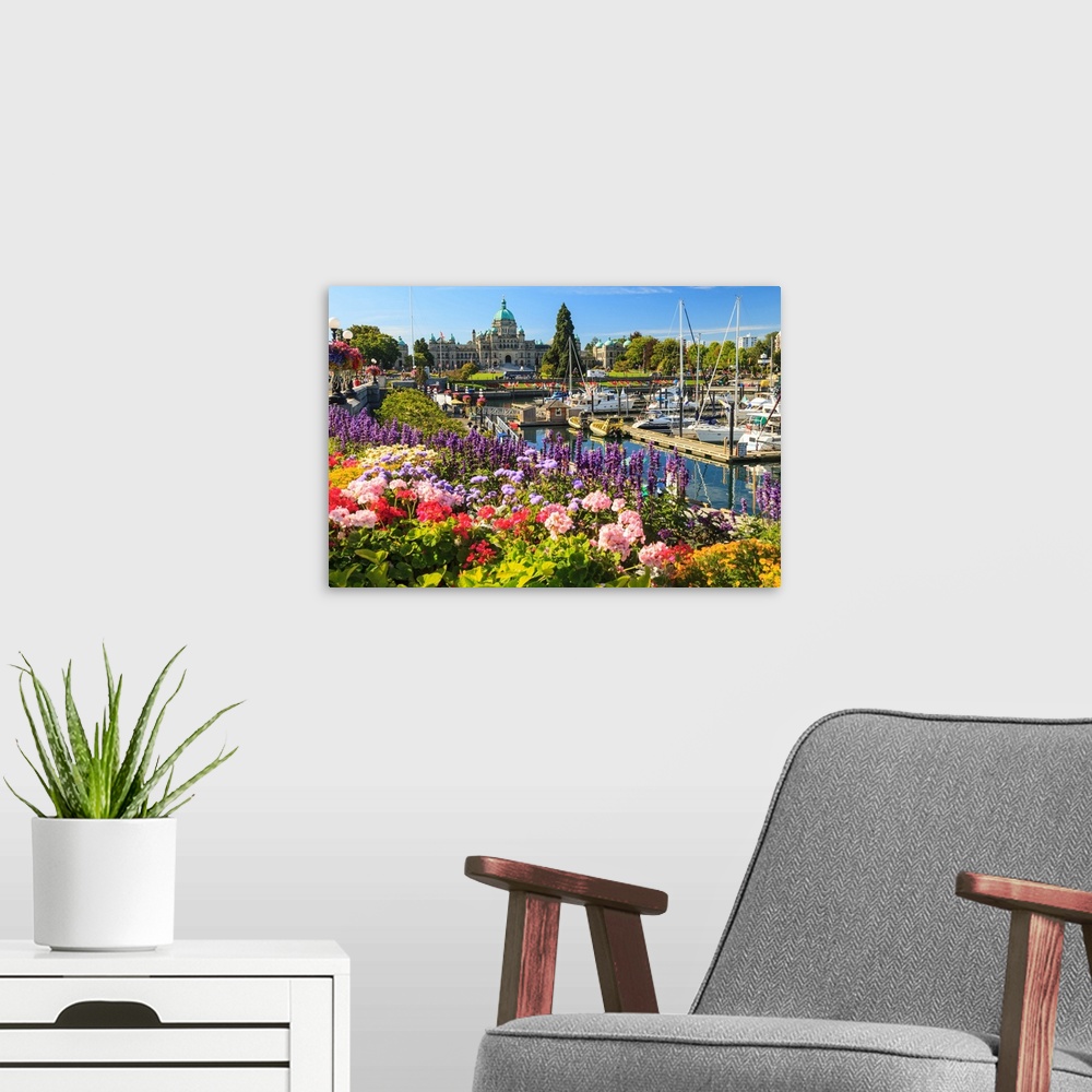 A modern room featuring Summer flowers at Inner Harbour, Parliament Buildings behind, Victoria, Capital of British Columb...