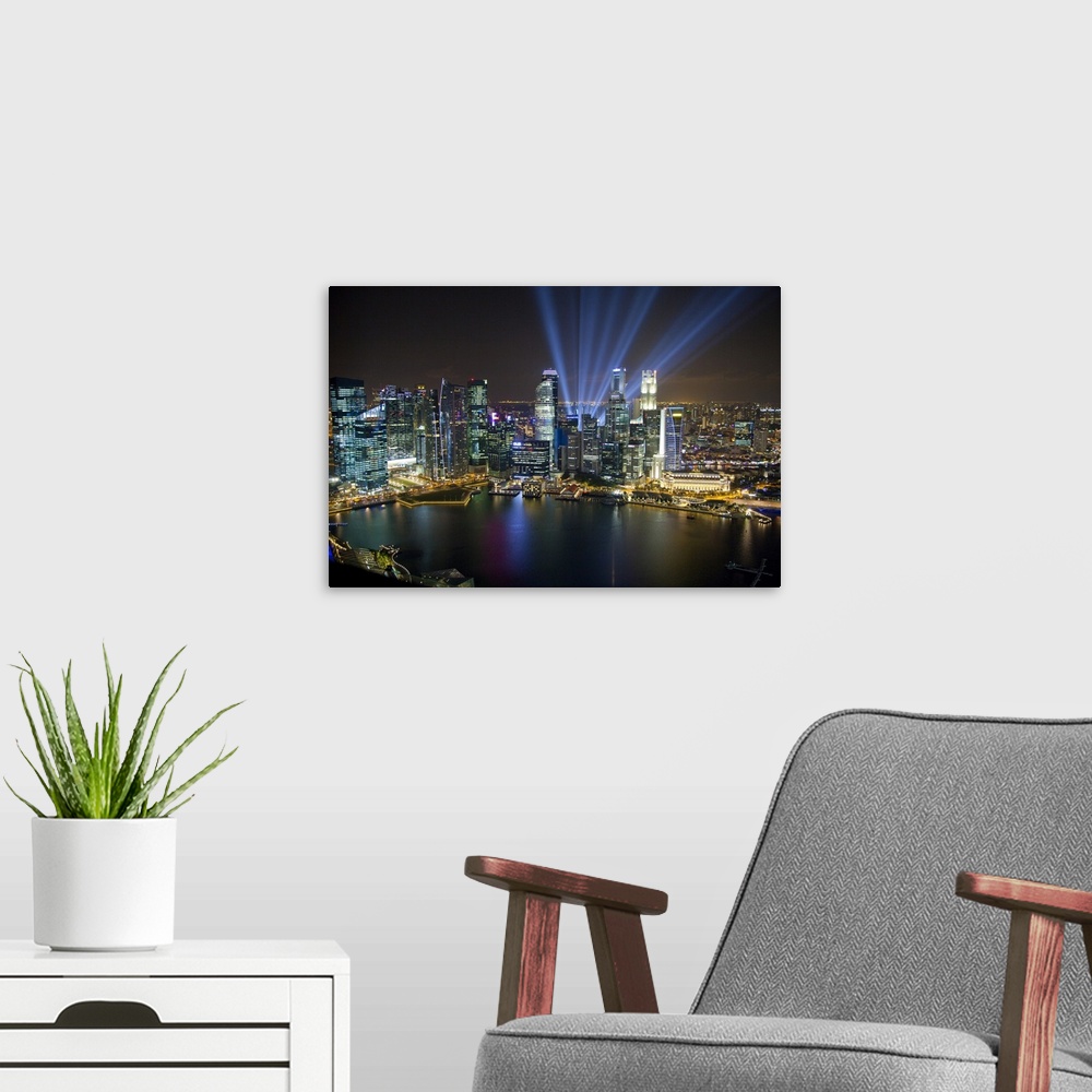 A modern room featuring Singapore. City at night.