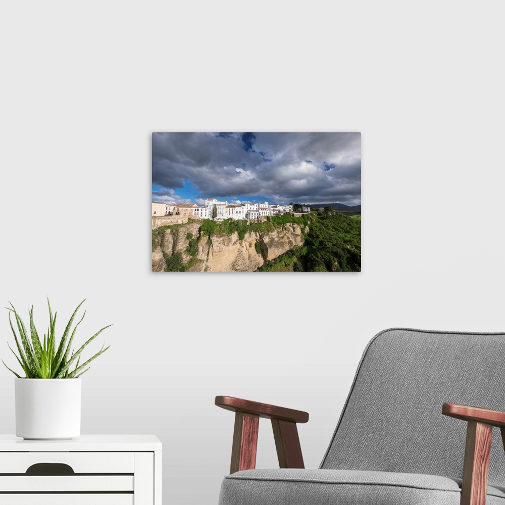 A modern room featuring Spain, Andalusia. Ronda perches on the rugged defensible limestone cliffs.