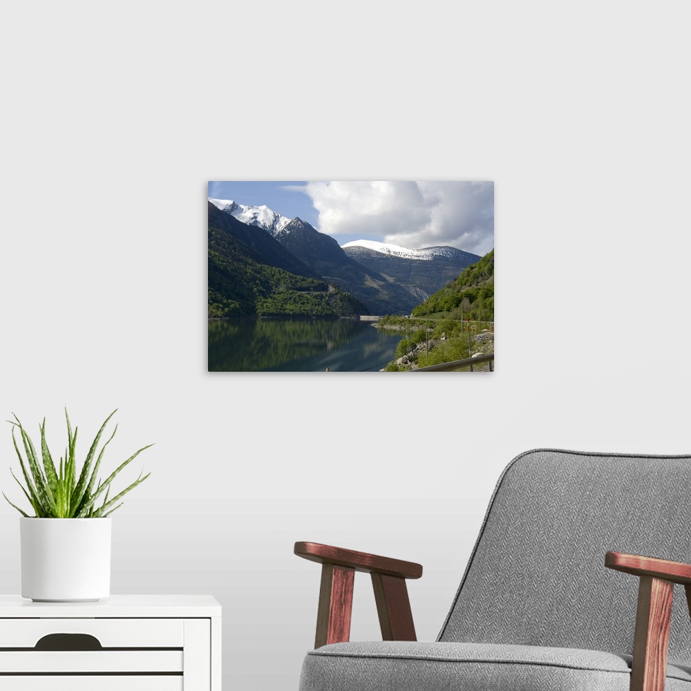 A modern room featuring Spain, Catalonia, Pyrenees Mountains. View of lake and dam from mountian road.