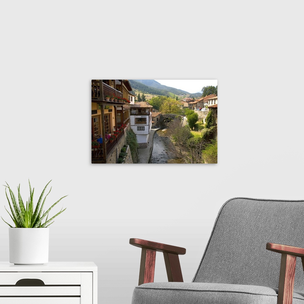 A modern room featuring The river Bullon in the village of Potes, Liebana, Cantabria, northwestern Spain.