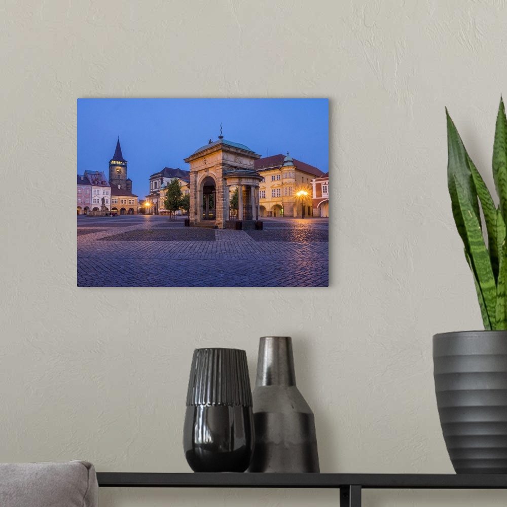 A modern room featuring Europe, Czech Republic, Jicin. Twilight in the main square surrounded with recently restored hist...