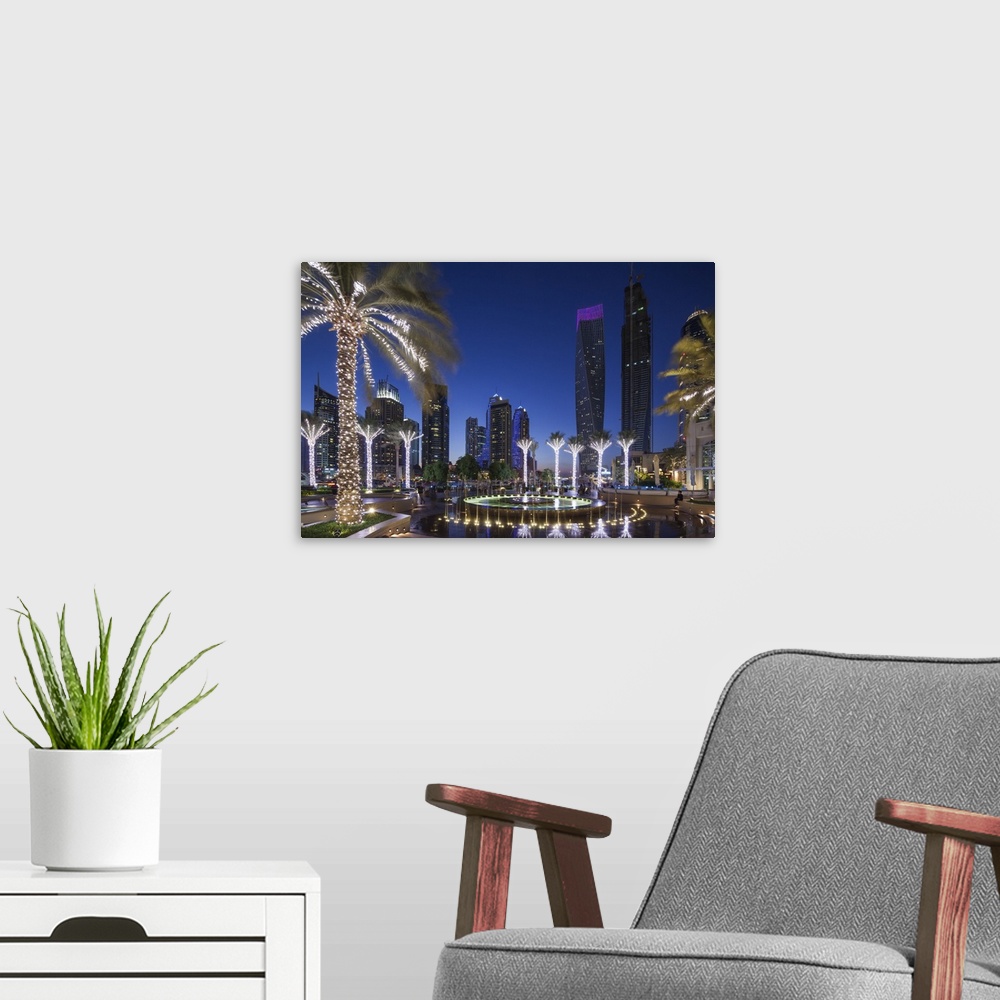 A modern room featuring UAE, Dubai, Dubai Marina, high rise buildings including the twisted Cayan Tower, dusk