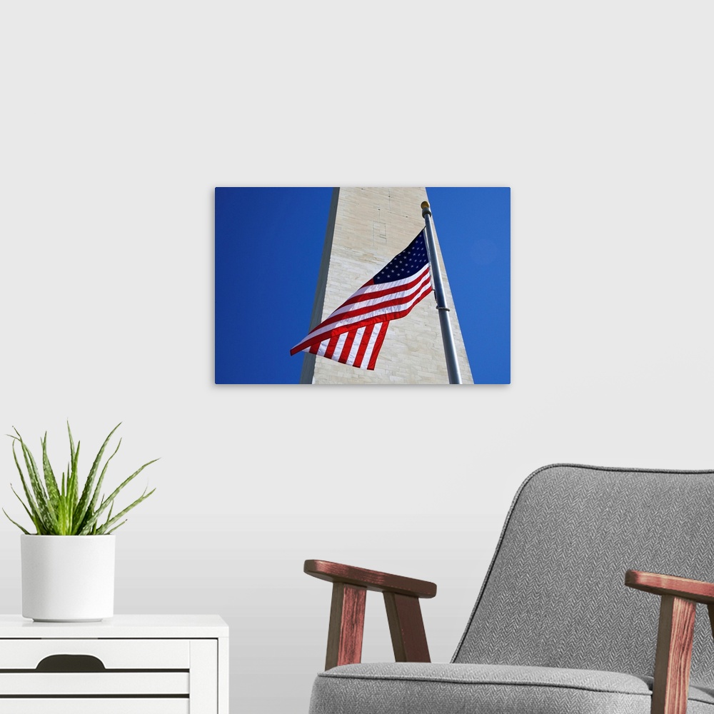 A modern room featuring USA, Washington DC. American flag and the Washington Monument.