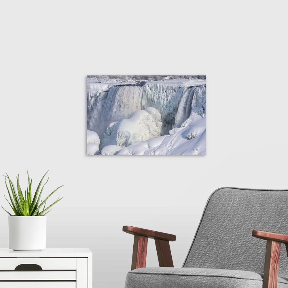 A modern room featuring Niagara fall freezing over in a cold winter.