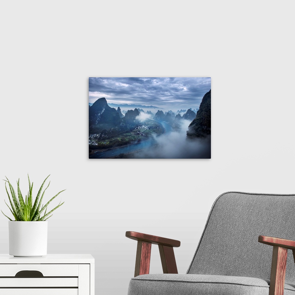 A modern room featuring Aerial view of Guilin city, river and mountains in fog, China, Asia.