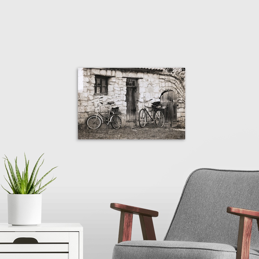 A modern room featuring Artwork in vintage style, bicycles.