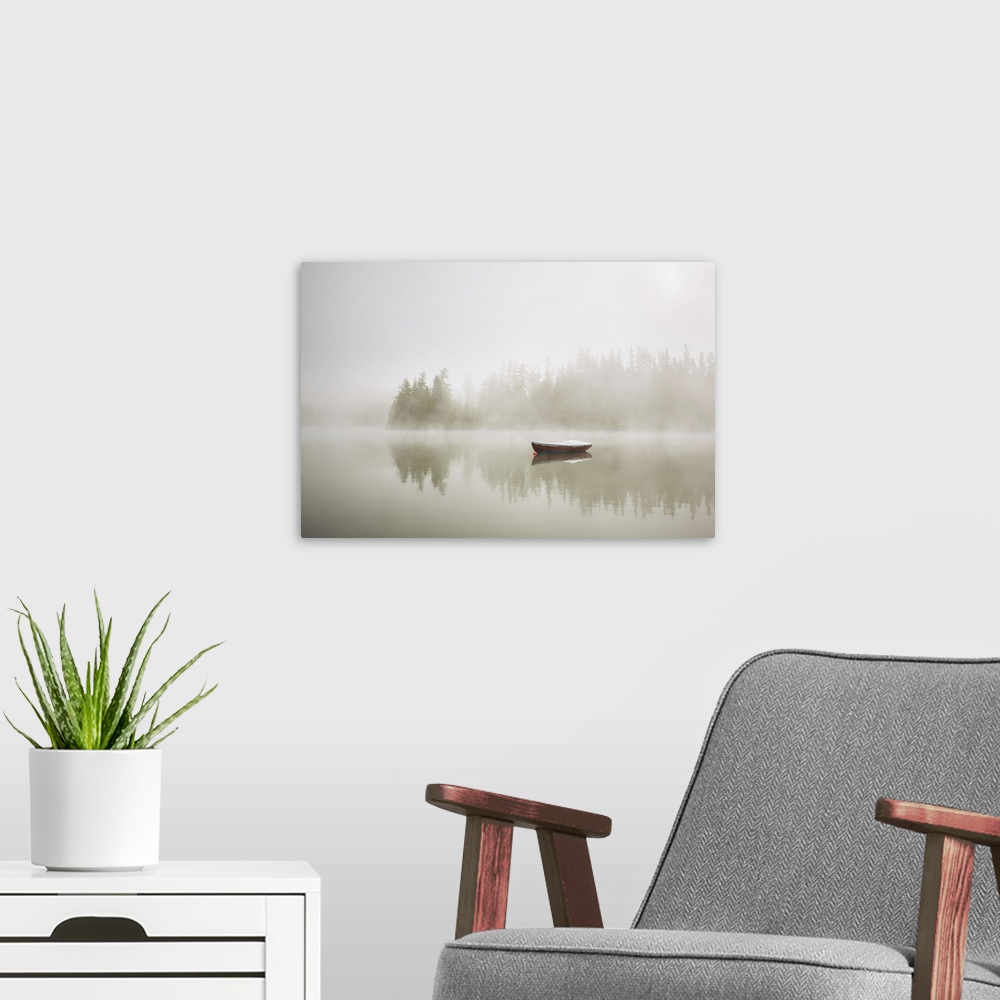 A modern room featuring Boat on the lake at morning fog.