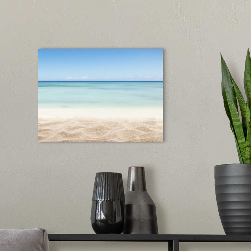 A modern room featuring Empty sandy beach with sea.