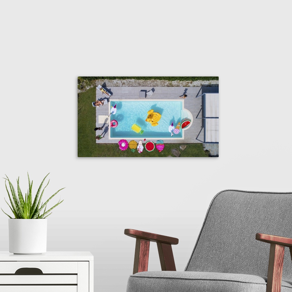 A modern room featuring Friends Having Fun In A Swimming Pool