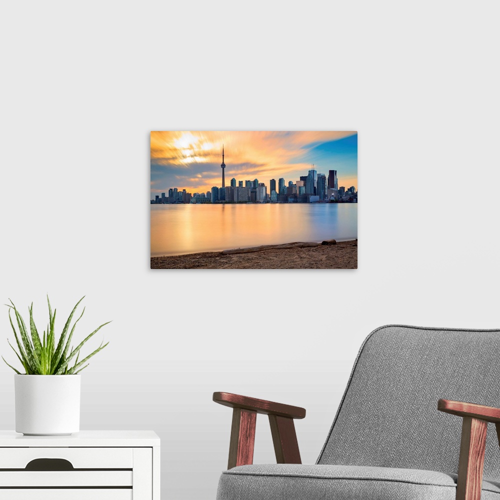 A modern room featuring Canada, Ontario, Toronto, Skyline at sunset.