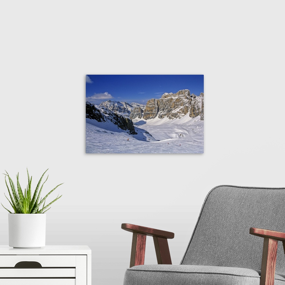 A modern room featuring Italy, Cadore, Cortina d'Ampezzo, Skiers descend the slopes near Lagazuoi mountain