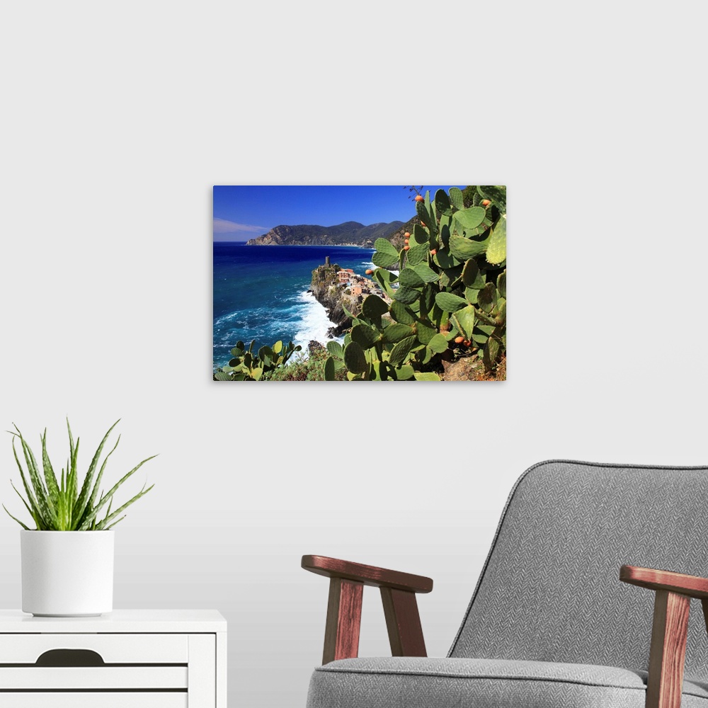 A modern room featuring Italy, Liguria, Cinque Terre, Prickly pear trees with Vernazza