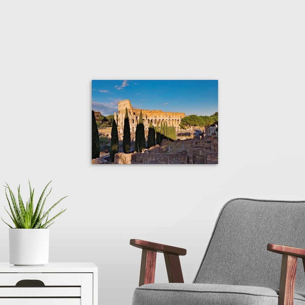 A modern room featuring Veduta del Colosseo dall'arco di Settimio Severo con in primo piano la via Sacra e le rovine del ...