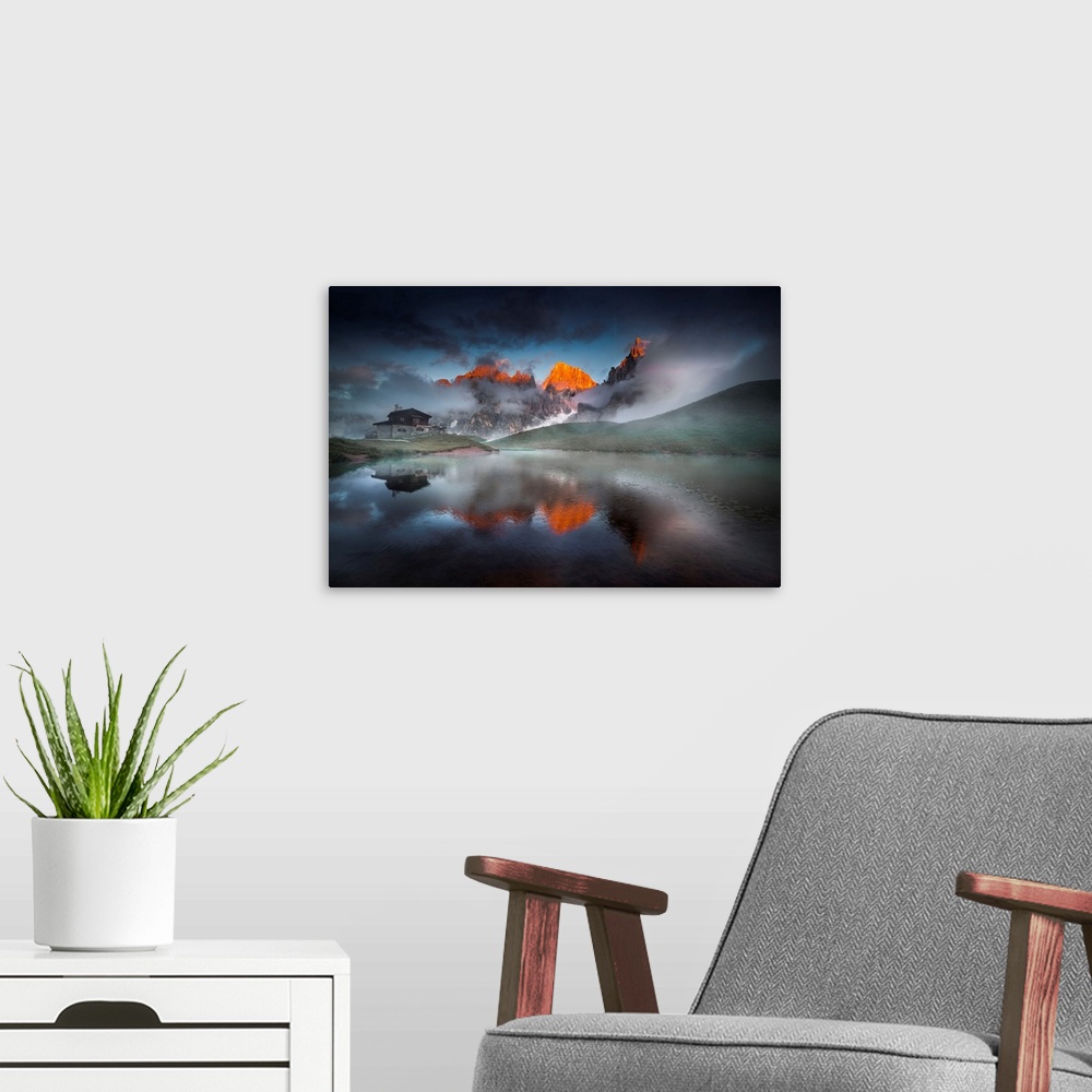 A modern room featuring Italy, Trentino, Pale di San Martino, reflecting on an alpine lake on a cloudy sunset.