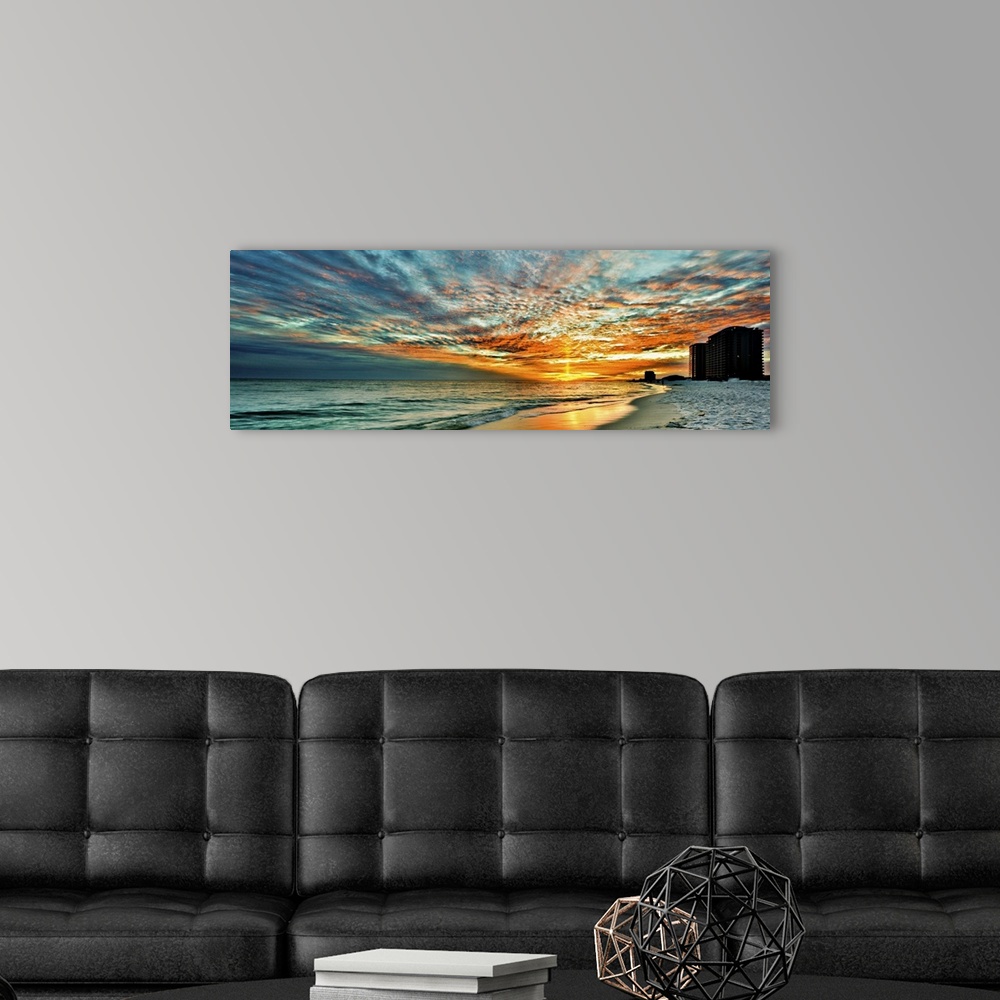 A modern room featuring A magnificent red skyscape in this panoramic sunset. Landscape taken on Navarre Beach, Florida.