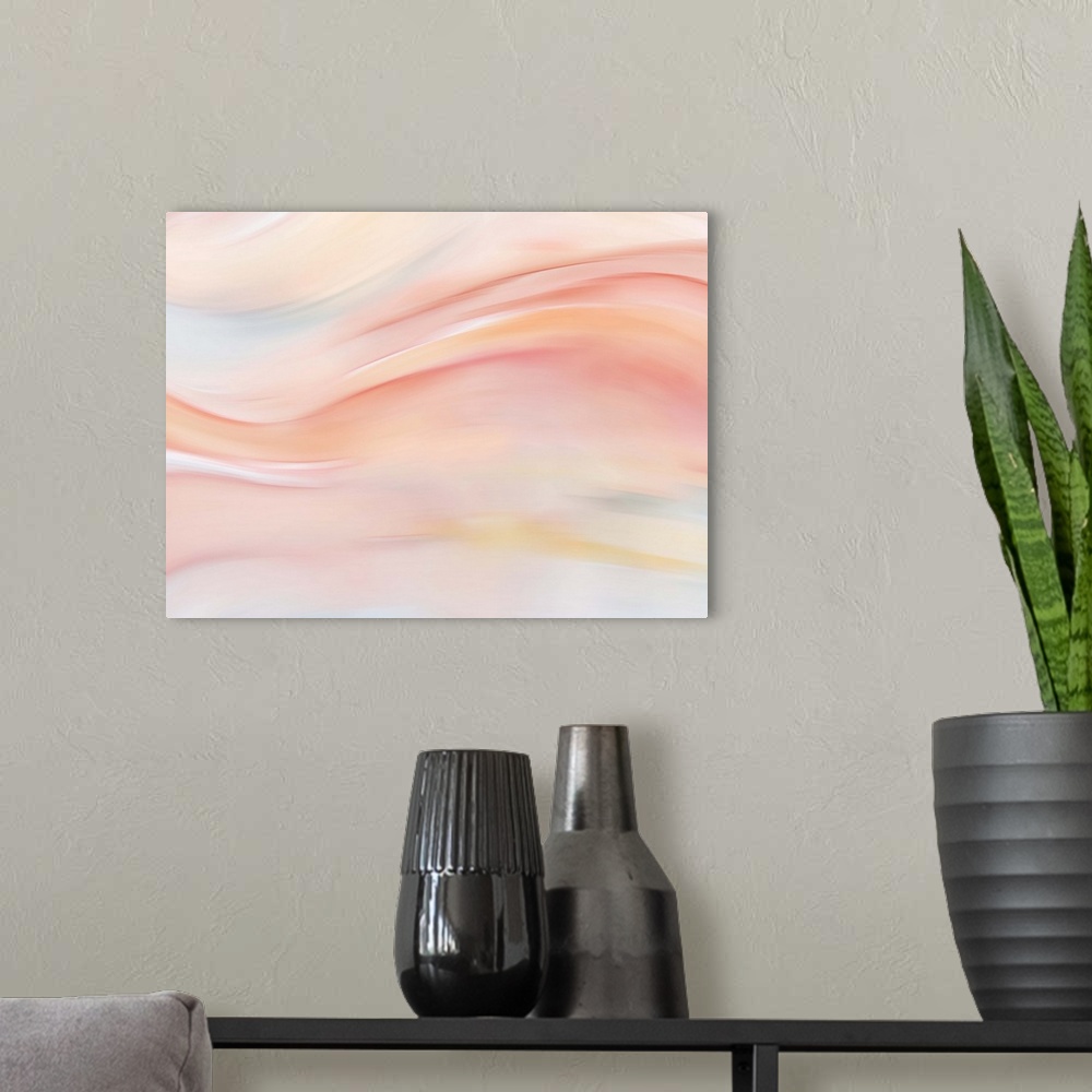 A modern room featuring Large abstract painting with pastel hues and flowing movement from left to right across the canvas.