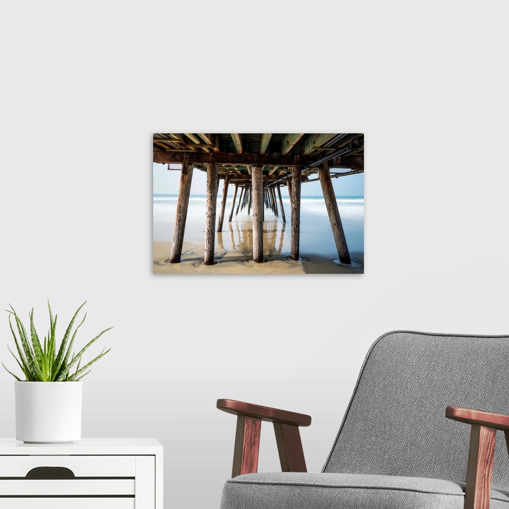 A modern room featuring Photograph looking under the Imperial Beach pier, California.