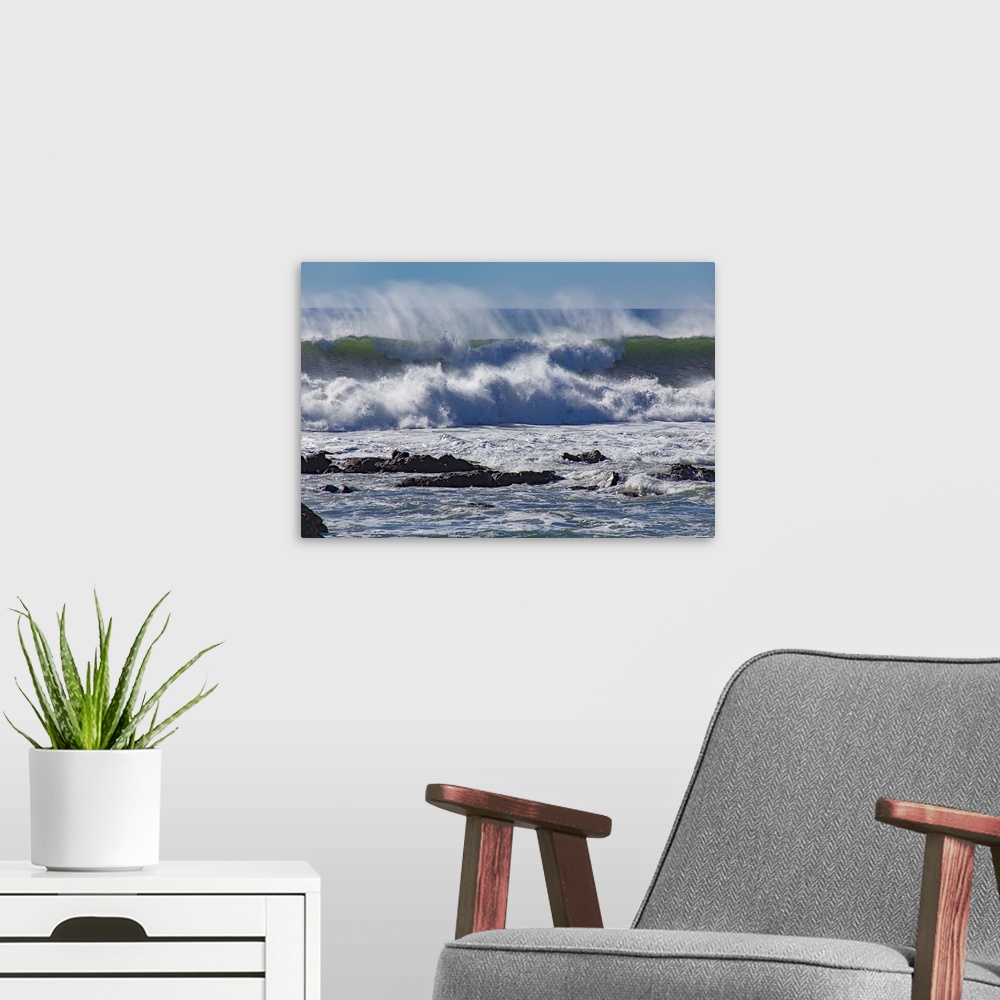 A modern room featuring Photograph of a big dramatic wave crashing over rocks in North Cayucos, California.