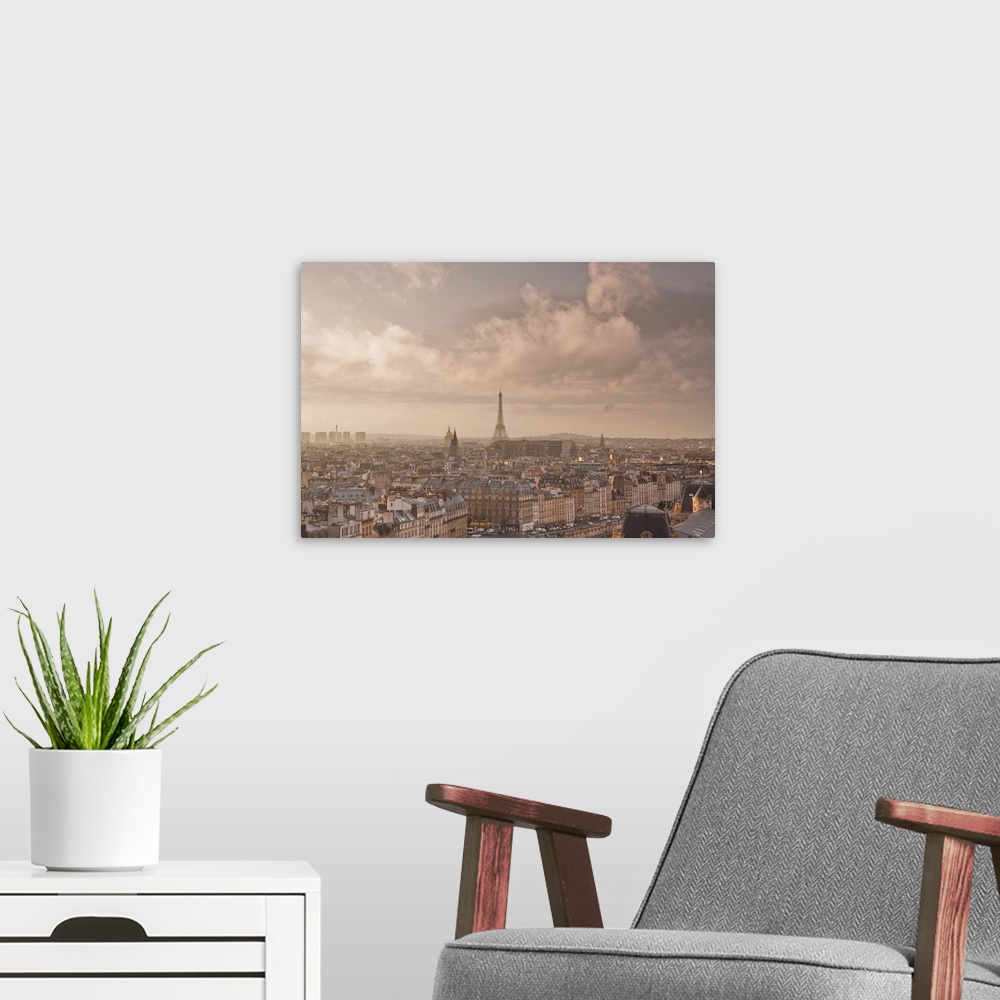 A modern room featuring A heavy storm passes over the city of Paris.
