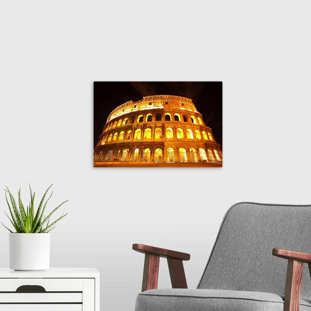 A modern room featuring A lit Colosseum in Rome, Italy