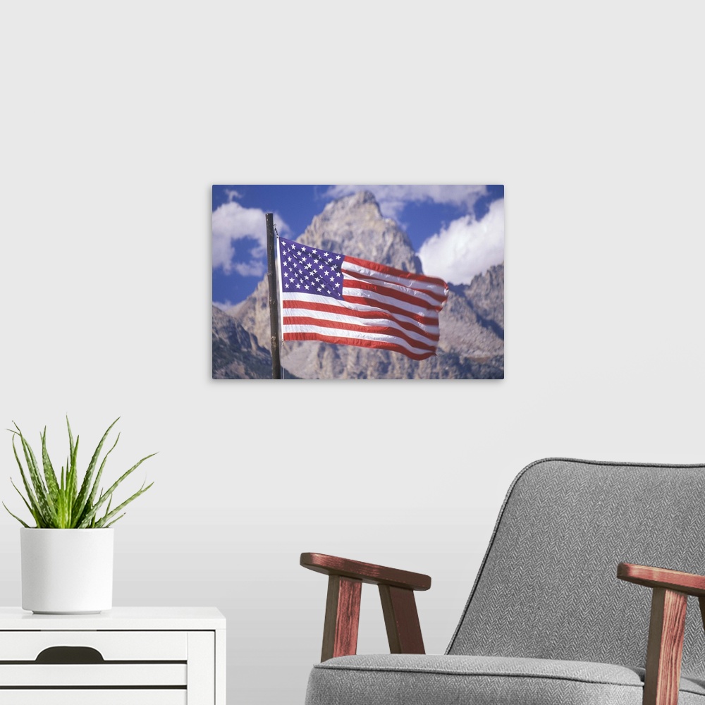 A modern room featuring 'American Flag with Mountains, Grand Teton National Park, Wyoming'