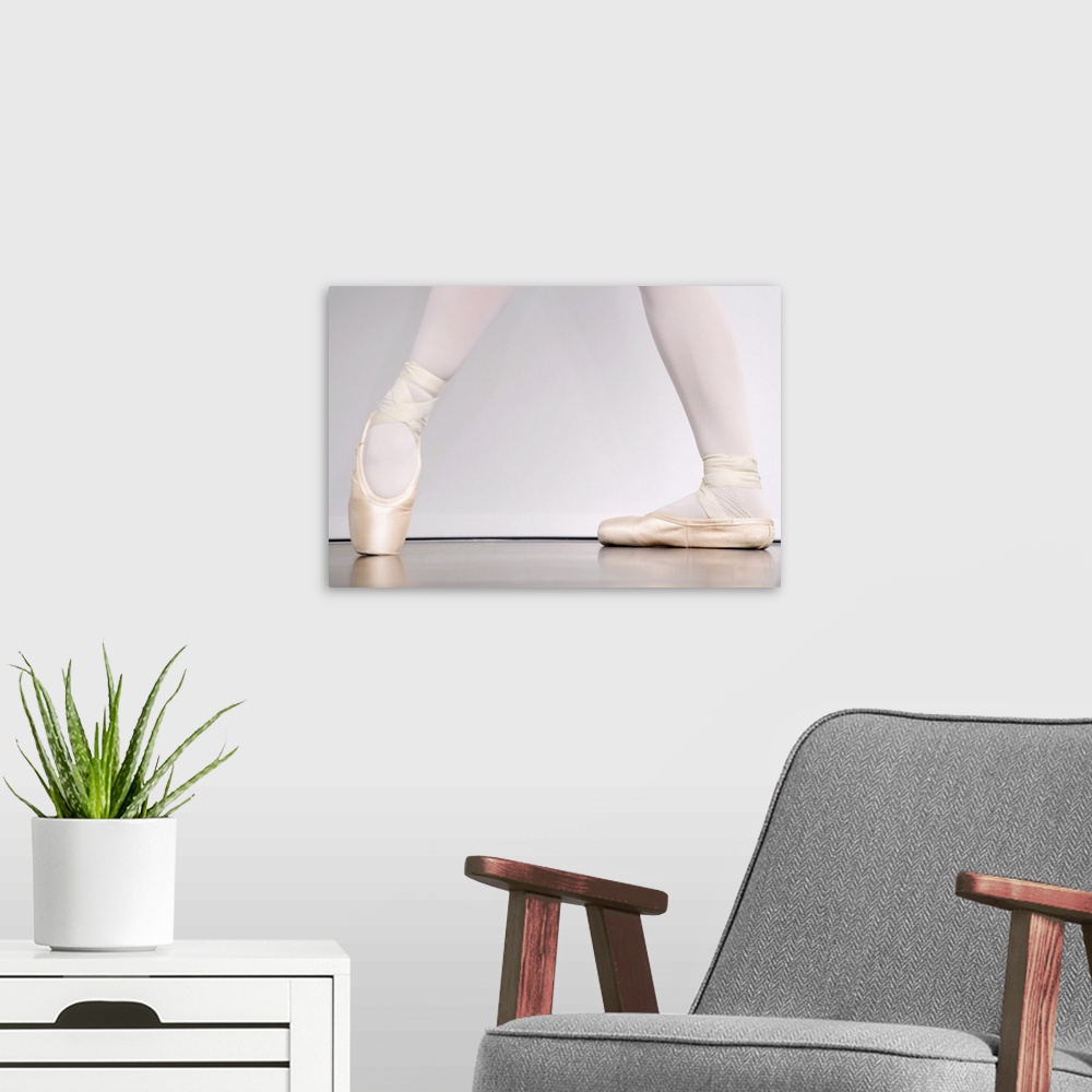 A modern room featuring Ballerina in pointe shoes
