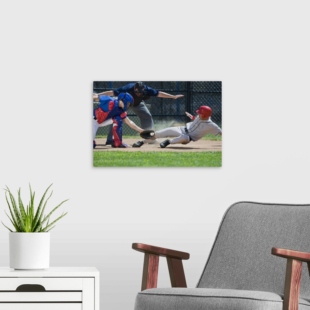 A modern room featuring Baseball player sliding into home plate