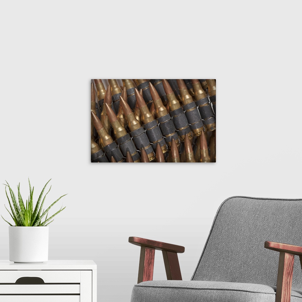 A modern room featuring Belt feed ammunition for the M249 light machine gun, also known as the M249 Squad Automatic Weapo...