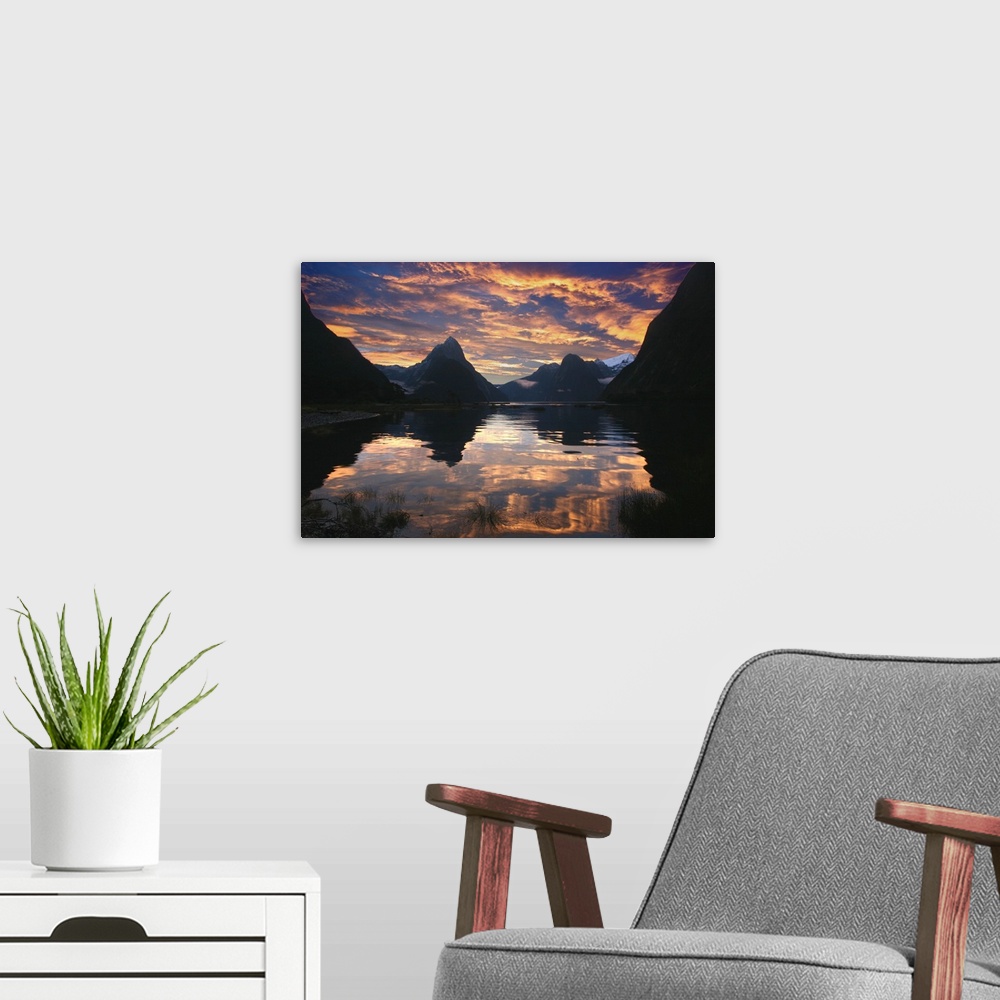 A modern room featuring Milford Sound, New Zealand at sunset after a rain storm.  A wider and brighter version of a photo...