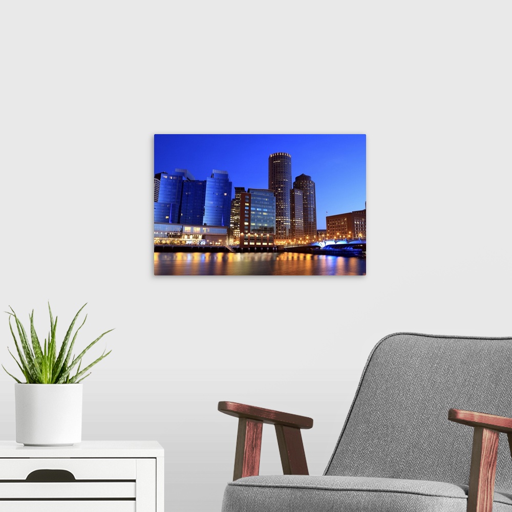 A modern room featuring Boston Harbor and skyline.  Boston is one of the oldest cities in the United States and largest c...