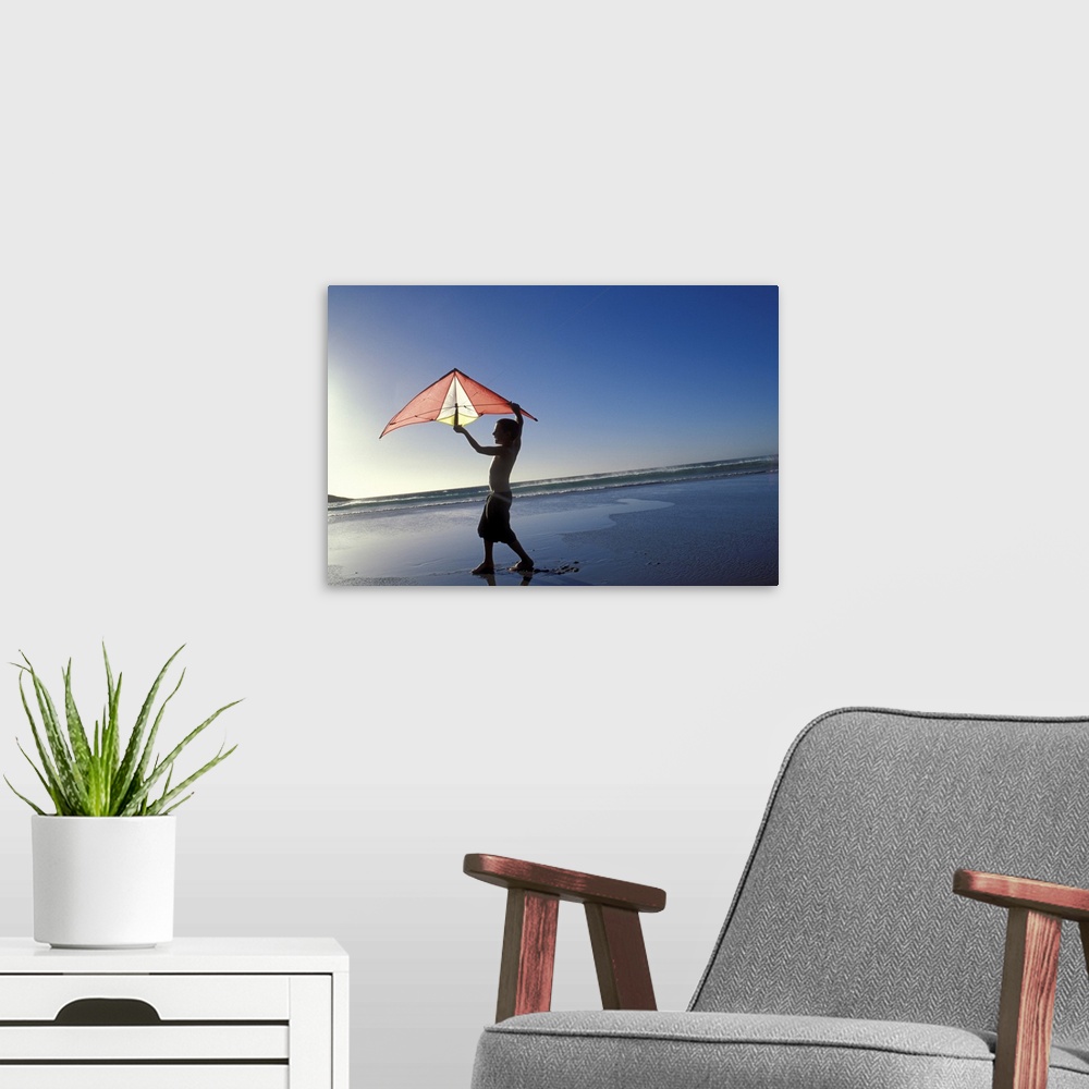 A modern room featuring Boy flying kite at beach