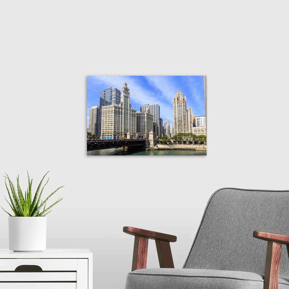 A modern room featuring The Wrigley Building and Tribune Tower stand north of the DuSable Bridge on the Chicago River, Ch...