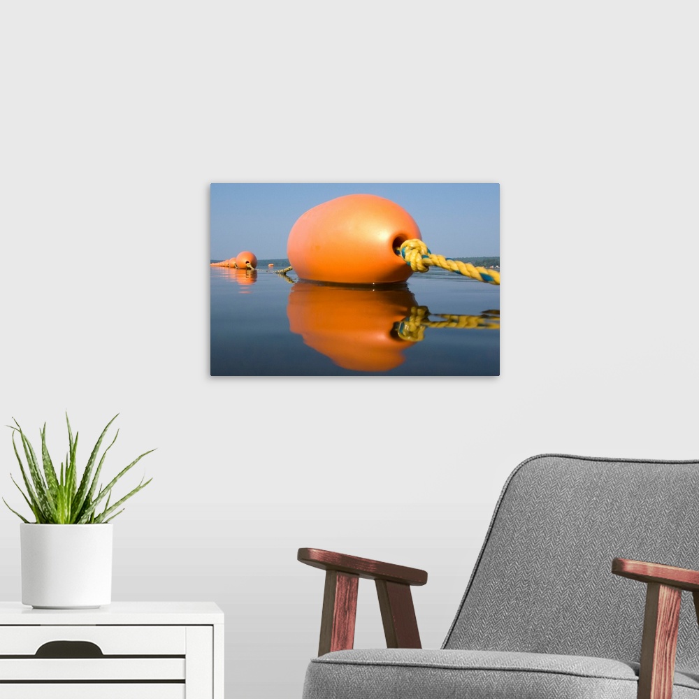 A modern room featuring Orange Buoy on a calm lake in the summer. Jefferson, Maine