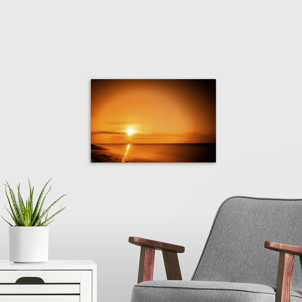 A modern room featuring The sun rises over The Gulf of Mexico in this waterscape. Taken in the Surfside Beach area, Brazo...