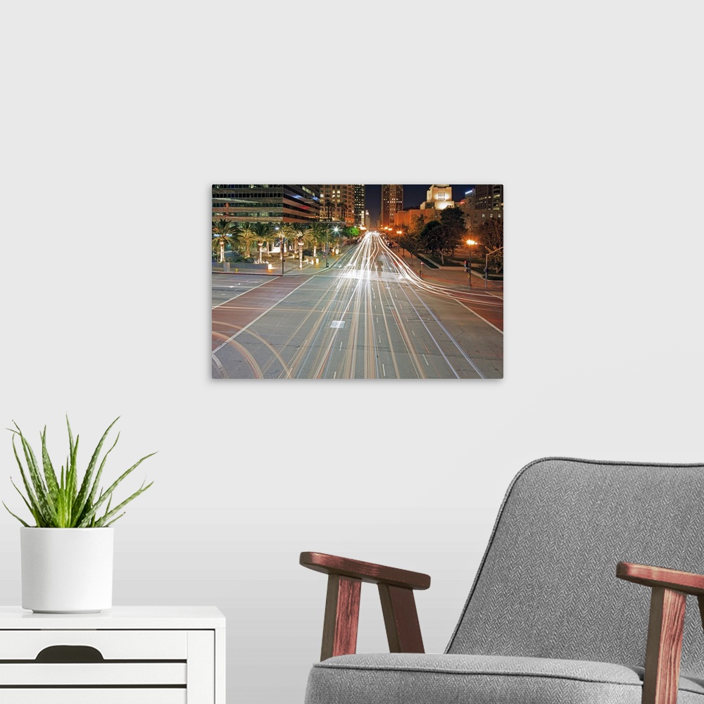 A modern room featuring City light trails on street in Downtown with building, Crossroad at Los Angeles, California, Unit...