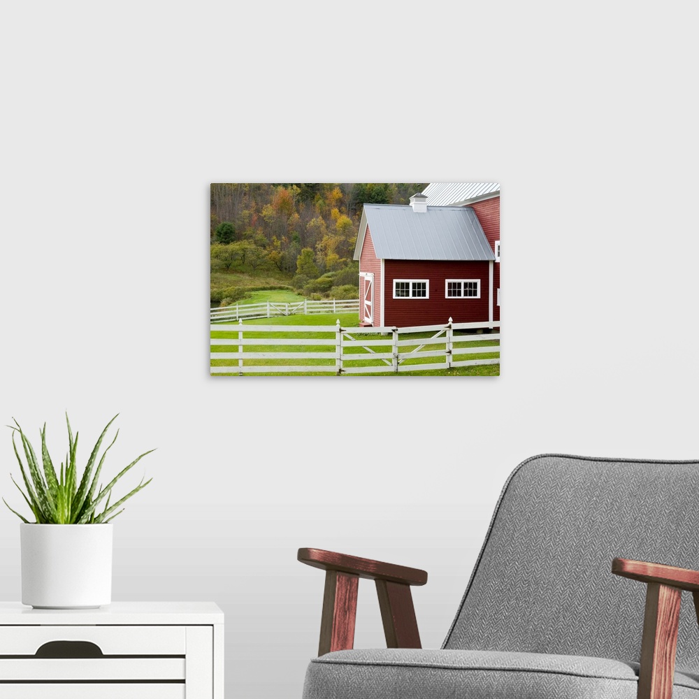 A modern room featuring Classic New England farm with red barn and white fence. Vermont. USA