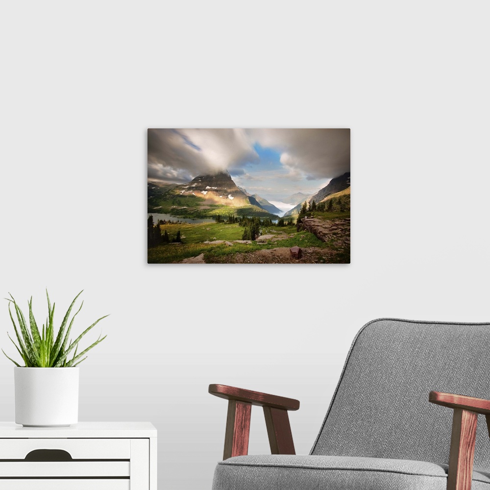A modern room featuring Severe weather at sunrise at Logan Pass in Montana.  Green grass, pine trees, alpine lakes, snow,...